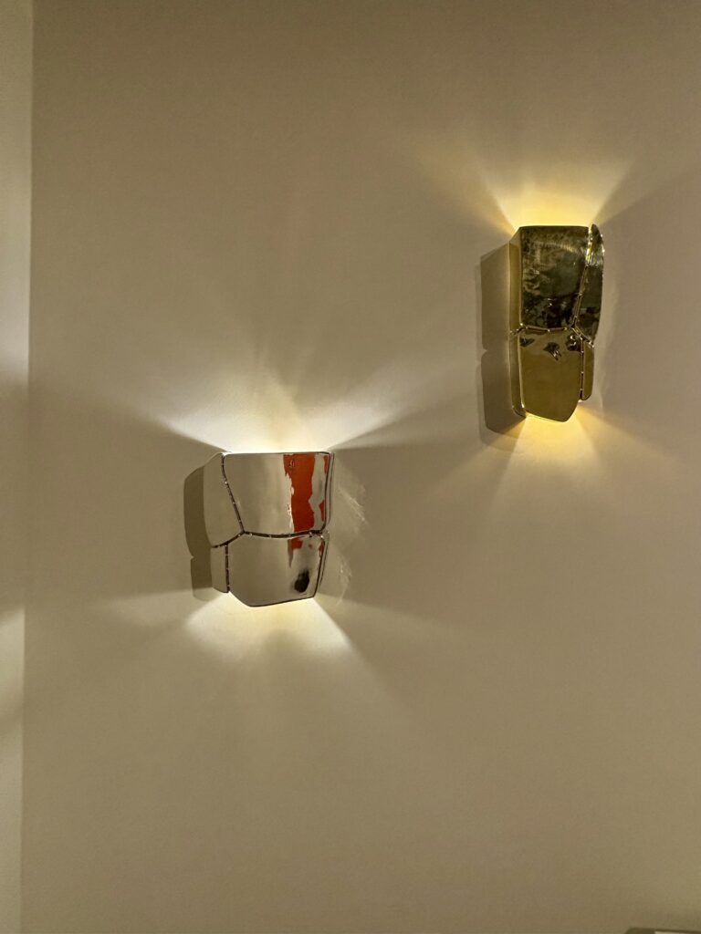 Shimmery sconces from Aequo Gallery in Mumbai.